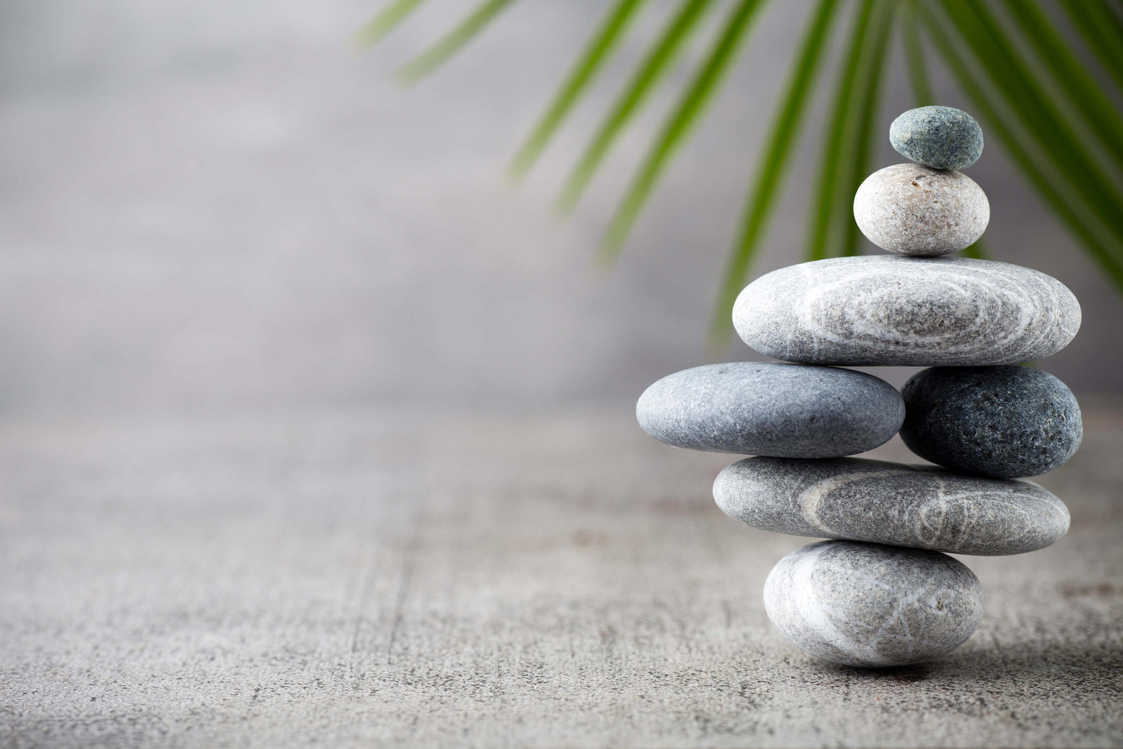 Picture of a calming stack of smooth grey stones reminding us we need a balanced life with low carb, gluten free grain free diet
