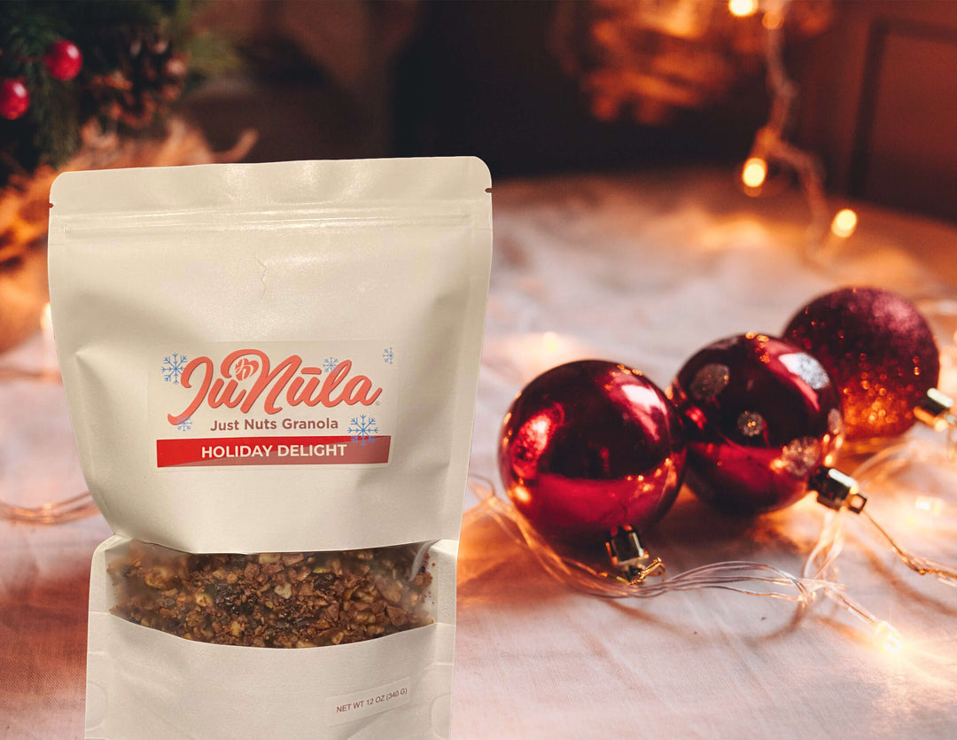 Photo of seasonal varietal Holiday Delight JuNūla Just Nuts Granola next to some festive holiday decorations