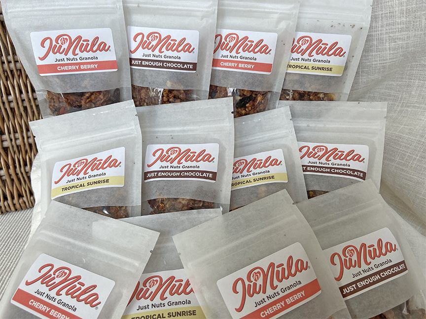 Picture of twelve two ounce bags of JuNula just nuts granola, gluten free, grain free,  low carb granola perfect to take with you when you are on the go